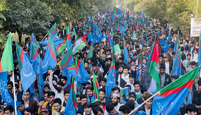 In this picture, Islami Jamiat-i-Talba (IJT) workers and activists waved party flags during a rally on December 8, 2023. — Facebook/Islami Jamiat Talaba University of Peshawar