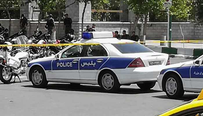 This photo shows police vehicles and motorcycles outside the Iranian parliament in Tehran. — AFP/File