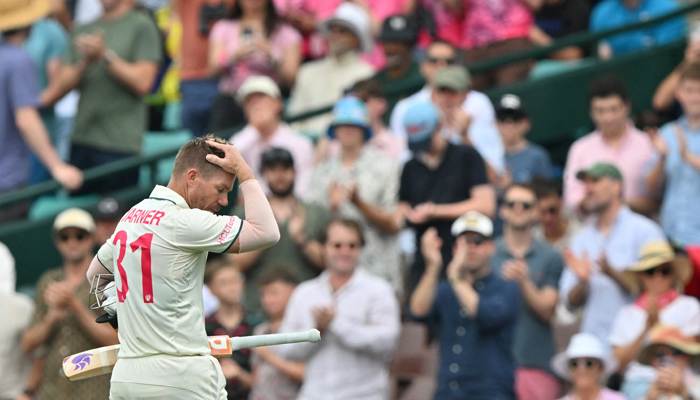 Australias David Warner walks off the field after his dismissal during the second day of the third cricket Test match against Pakistan at the Sydney Cricket Ground in Sydney on January 4, 2024. — AFP