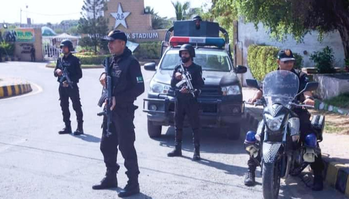 Sindh police personnel stand guard in front of Karachi Stadiums main gate in Karachi on May 23, 2023. — Facebook/Sindh Police