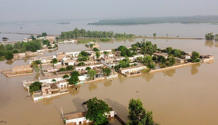 A view of a flooded area is pictured from atop a bridge in Charsadda, KP on August 27, 2022. — AFP