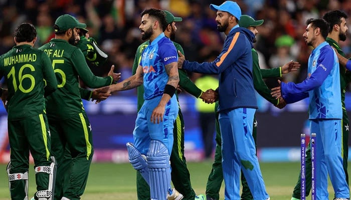 Players from both teams shake hands after the ICC mens Twenty20 World Cup 2022 cricket match between India and Pakistan at Melbourne Cricket Ground in Melbourne on October 23, 2022. — AFP