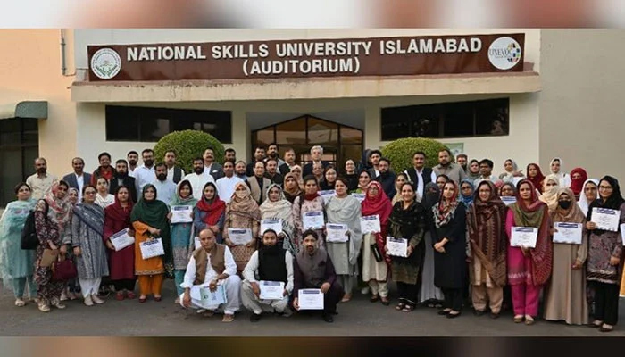 National Skills University Islamabad building with students can be seen in this image.—x/hecpkofficial