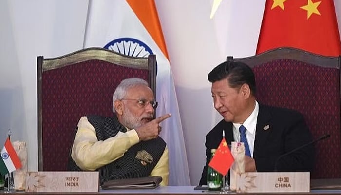 Prime Minister Narendra Modi (L) with China’s President Xi Jinping. — AFP/File
