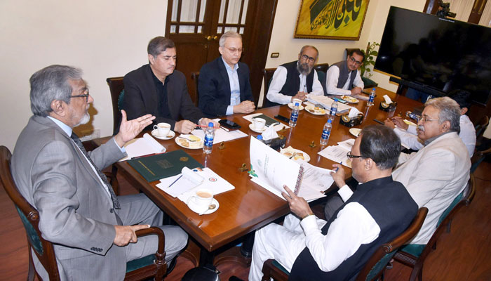 Caretaker Chief Minister Justice (retd) Maqbool Baqar presides over a meeting of the National Institute of Cardiovascular Diseases (NICVD) at the CM House on Dec 29, 2023. — APP