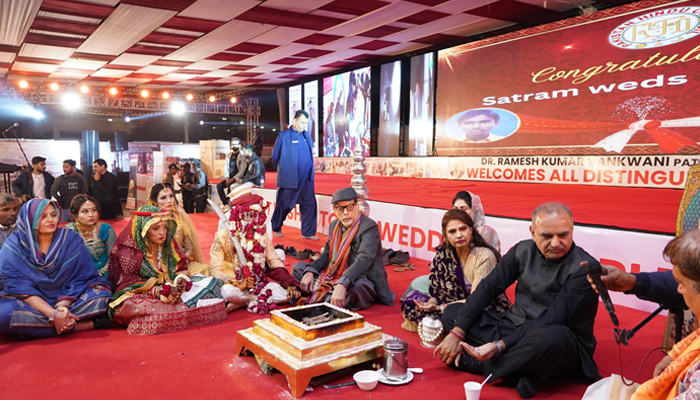 Sindh caretaker minister for information and minority affairs Syed Ahmed Shah as a guest sits during the mass wedding ceremony organized by the Pakistan Hindu Council (PHC) at Karachi’s Railway Ground on January 7, 2024. —Facebook/Mohammad Ahmed Shah