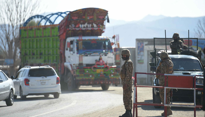An army soldiers stand guard at a check point in North Waziristan. — AFP/File