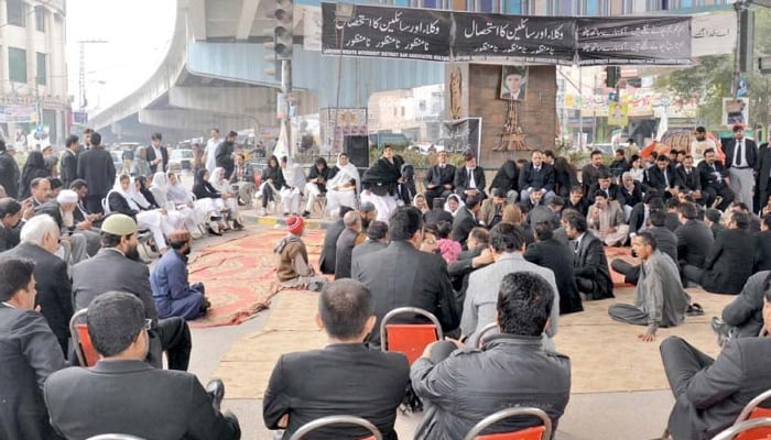 Lawyers stage a sit-in at Katcheri Chowk in favor of their demands.—Online/File