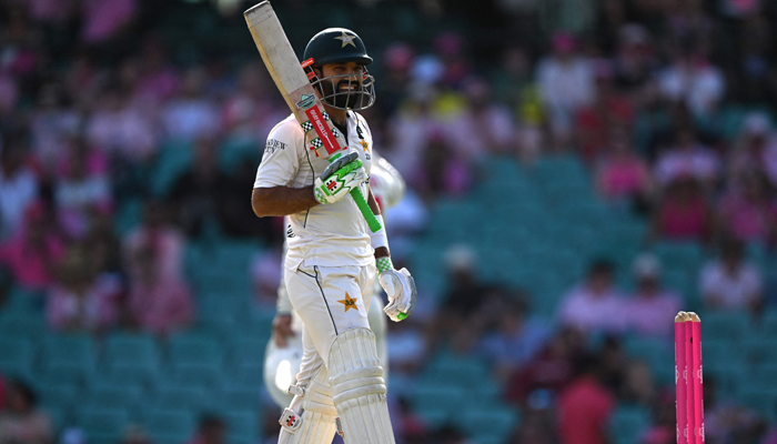 Mohammad Rizwan smiles as he gets ready to bat during day three of the third cricket Test match between Australia and Pakistan at the Sydney Cricket Ground in Sydney on January 5, 2024. — AFP