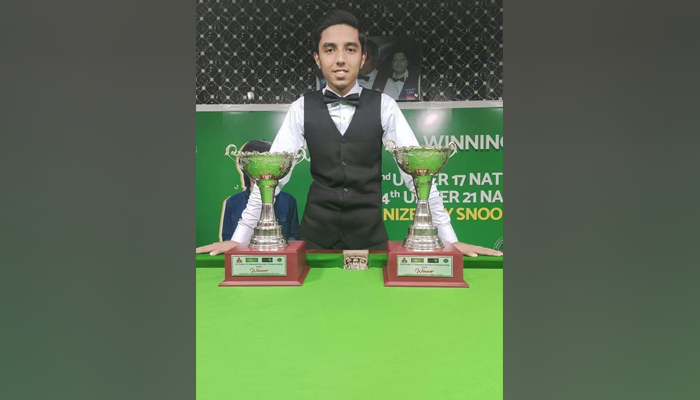 Sindh’s Mohammad Hasnain poses for a picture after being crowned as the champion of the 14th National Junior Under-21 Snooker Championship at the PSB Coaching Centre on January 8, 2024. — Facebook/786 Shender Snooker Academy