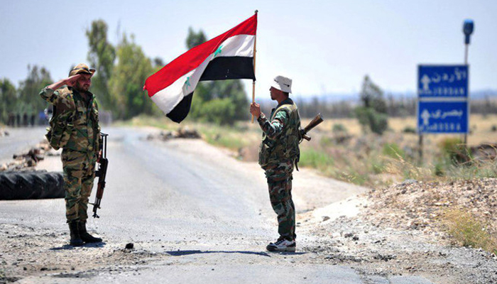 This image shows two Syrian army soldiers standing. — AFP/File