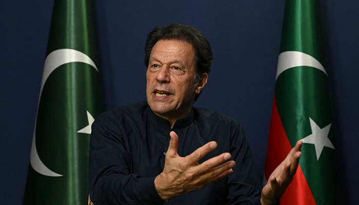 Former Pakistans Prime Minister Imran Khan gestures as he speaks during an interview with AFP at his residence in Lahore on May 18, 2023.—AFP