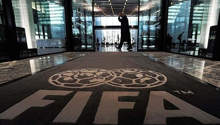 The logo of the FIFA is pictured on a carpet at the entrance of the FIFA headquarters in Zurich. — AFP/File