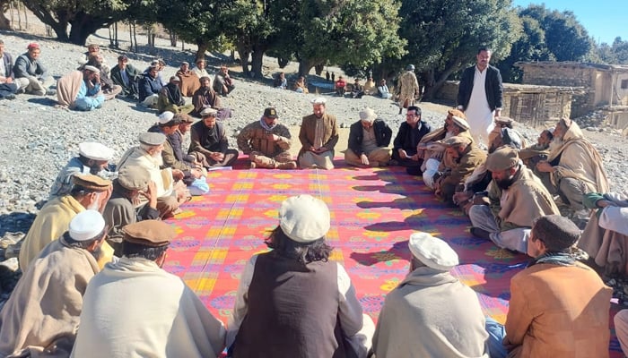 This image shows local officials and elders during a jirga on January 10, 2024, in KP. — Facebook/Assistant Commissioner Upper Kurram
