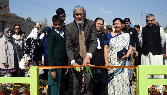 Caretaker Sindh CM, Justice (R) Maqbool Baqar cuts ribbon to inaugurate an indoor sports facility, organic farming facility and a cafe run by children with autism, at Centre for Autism Rehabilitation and Training located in Korangi area in Karachi on Thursday, January 11, 2024. — PPI