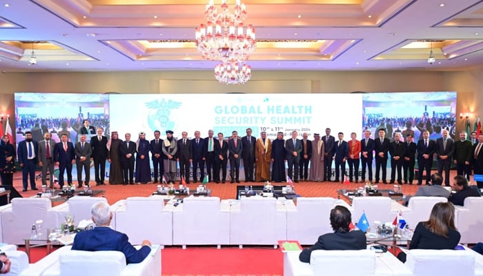 Participants take a pose on the stage of the global health security summit on January 11, 2024. — Facebook/Global Health Security Summit - Pakistan