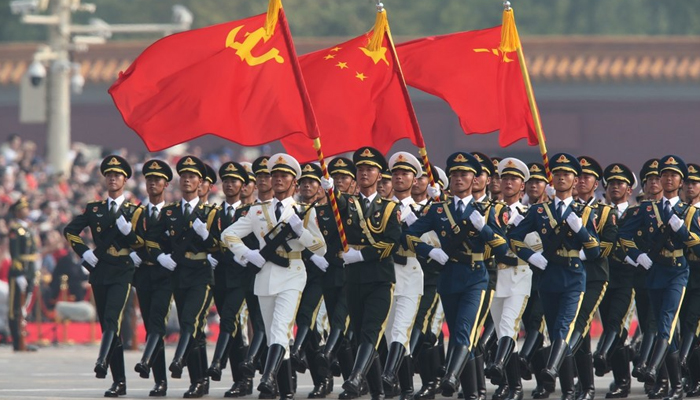 A formation of Guard of Honor marches in a military parade celebrating the 70th founding anniversary of the Peoples Republic of China in Beijing. — Xinhua/File