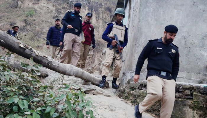 Peshawar police officials walk down during a survey on January 10, 2024. — Facebook/Khyber Pakhtunkhwa Police
