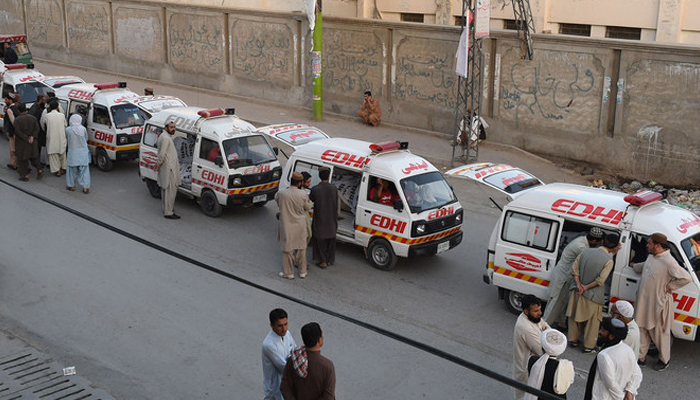 Ambulances can be seen parked on the road. — AFP/File