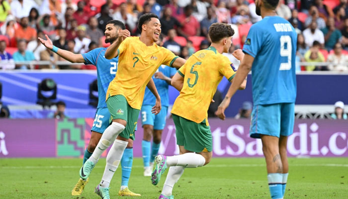 Australias Jordan Bos celebrates after scoring his teams second. — AFP