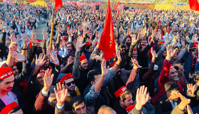 Awami National Party (ANP) workers and supporters hold party flags and wear party caps during party gathering on December 5, 2023. — Facebook/Awami National Party