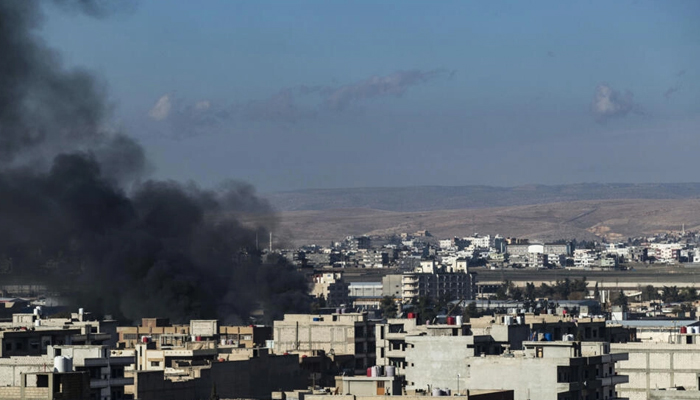 Smokes billow in Qamishli in northeastern Syria close to the Turkish border amid Turkish strikes. — AFP/File