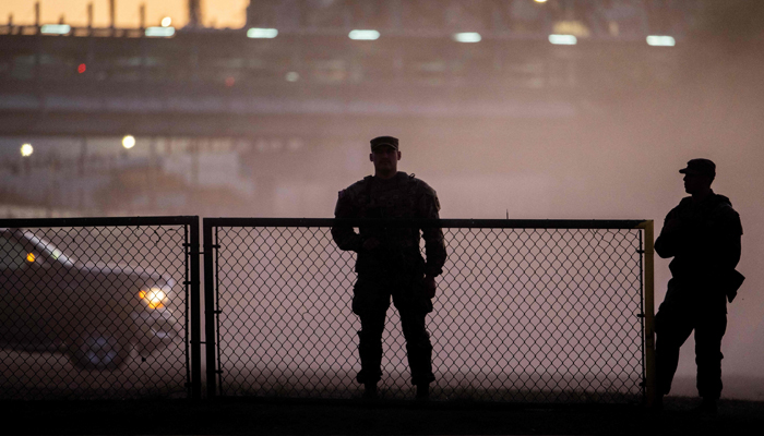 National Guard soldiers stand guard on the banks of the Rio Grande River at Shelby Park on January 12, 2024 in Eagle Pass, Texas. — AFP