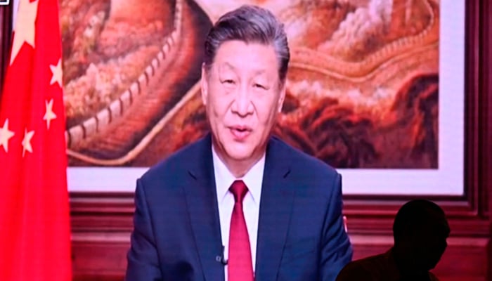 Chinas President Xi Jinping while delivering his New Years speech in Beijing on December 31, 2023. — AFP