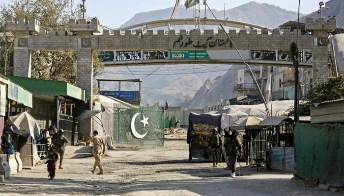 Border security personnel of Afghanistan and Pakistan stand guard at the zero point Torkham border crossing between the two countries, in Nangarhar province on January 15, 2024. — AFP