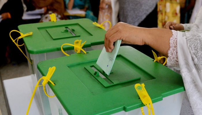 This image shows that woman casting her vote. — AFP/File
