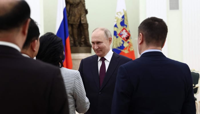 This photograph shows Russian President Vladimir Putin meeting with North Korean Foreign Minister Choe Son Hui at the Kremlin in Moscow on January 16, 2024. — AFP