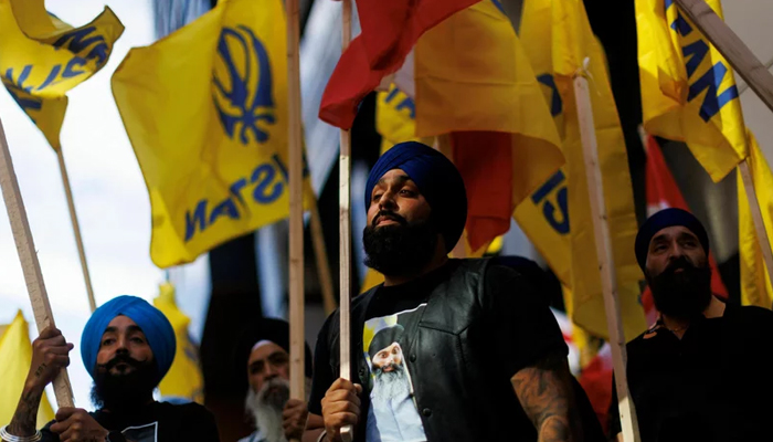 People hold flags during a Sikh rally outside the Indian Consulate in Toronto to raise awareness in the wake of the Canadian prime ministers comments. — AFP/File