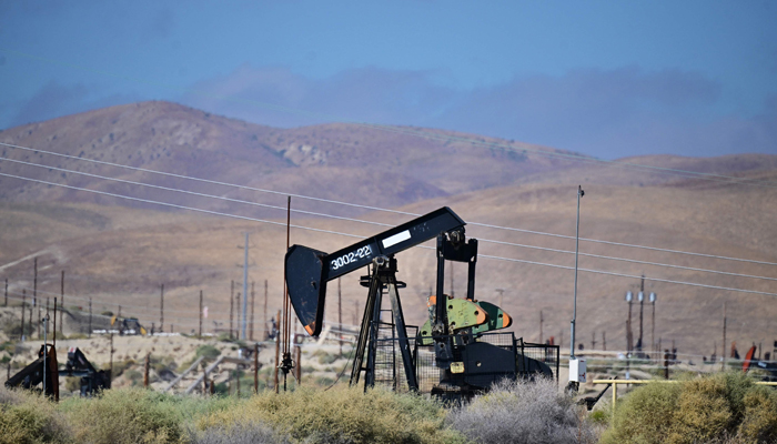 Working oil pumpjacks dot the landscape on oilfields on the outskirts of Taft, Kern County, California on September 21, 2023. — AFP
