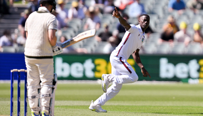 West Indies Shamar Joseph (L) celebrates after taking the wicket of Australian Steve Smith (R) during day one of the first cricket Test match between Australia and West Indies at Adelaide Oval in Adelaide on January 17, 2024. — AFP