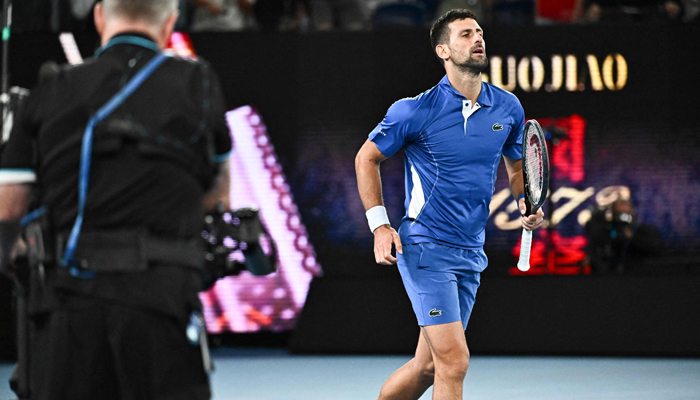 Serbias Novak Djokovic celebrates a match point against Australias Alexei Popyrin during their mens singles match on day four of the Australian Open tennis tournament in Melbourne on January 17, 2024. — AFP