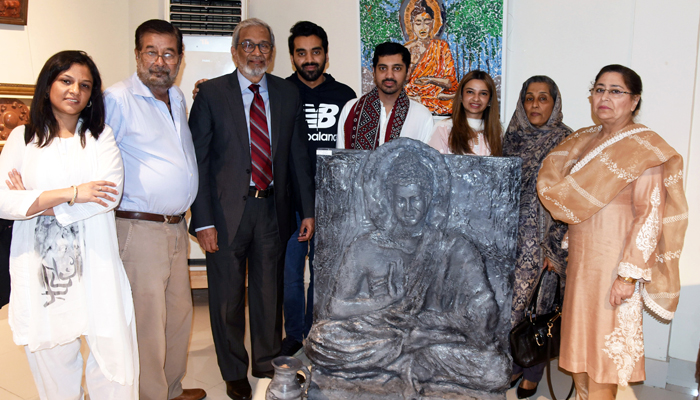 Caretaker Sindh Chief Minister Justice (Retd) Maqbool Baqar poses for a group photo with the sculptor Hussain Baqar at his work of Budha at the `Jawidan’ Art Exhibition at the Pakistan National Council of Art on January 17, 2024. — Facebook/Sindh Chief Minister House