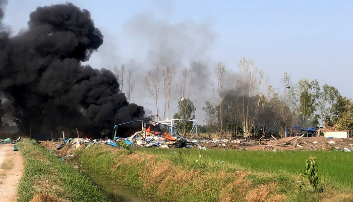 This handout from the Novice Kaew Suphanburi Highway Rescue Association taken and released on January 17, 2024, shows smoke rising after an explosion at a fireworks factory near Sala Khao township in Thailands Suphan Buri province. — AFP