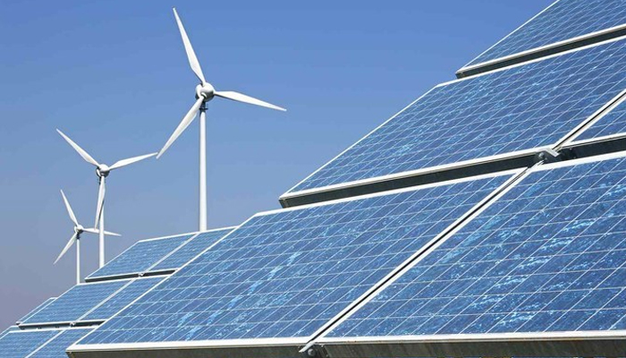 This image shows solar panels and wind turbines. — AFP/File