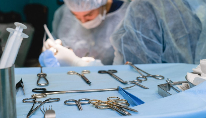 A representational image of a doctor performing a surgery. — Pexels