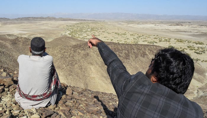 A local resident shows a mountain at the Koh-e-Sabz area of Pakistan´s south-west Baluchistan province where Iran launched an airstrike, on January 18, 2024. — AFP