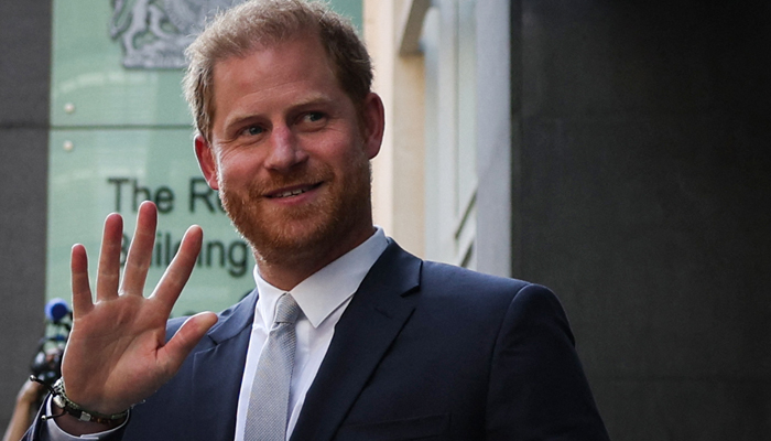 Britains Prince Harry, Duke of Sussex, waves as he leaves the Royal Courts of Justice, Britains High Court, in central London on June 7, 2023. — AFP