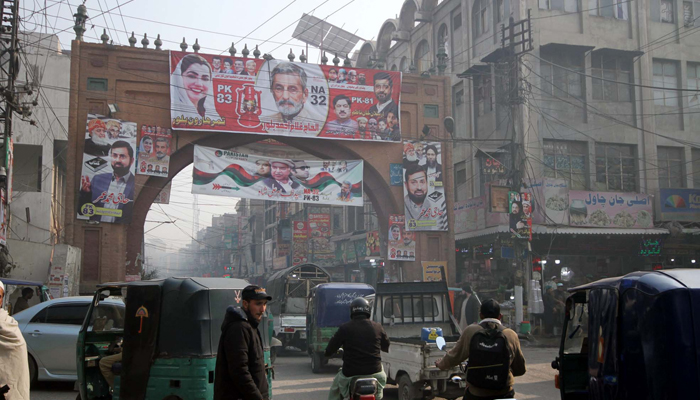 Banners and flags of different political parties have been placed on Kabuli Gate in connection with the upcoming General Election 2024, in Peshawar on January 14, 2024. — PPI