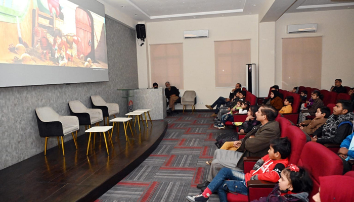 This image shows children of the employees of the Central Police Office watching a cartoon film in the office auditorium Darsgah On January 20, 2024. — Facebook/Punjab Police Pakistan