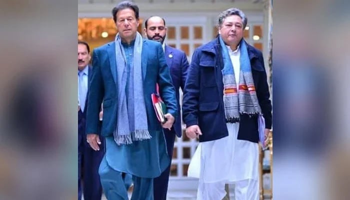 Former PM Imran Khan (left) and his then-principal secretary Azam Khan. — Facebook/PTI/File