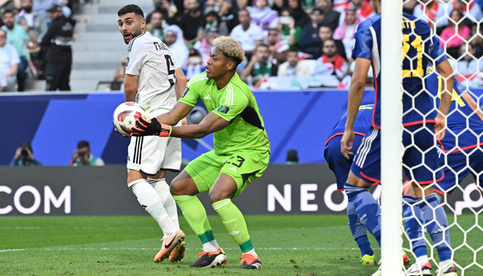 Japans goalkeeper, Zion Suzuki secures the ball during the Qatar 2023 AFC Asian Cup Group D football match between Iraq and Japan at the Education City Stadium in Al-Rayyan, west of Doha on January 19, 2024. — AFP