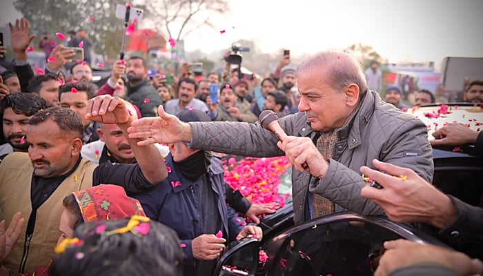 Former prime minister and Pakistan Muslim League Nawaz President Shehbaz Sharif interacts with supporters during a visit in Lahore On January 22, 2024. — Facebook/Mian Shehbaz Sharif