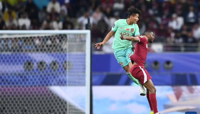 Abdel Aziz Hatim (R) of Qatar vies with Lin Liangming of China during the Group A match between Qatar and China of AFC Asian Cup at Khalifa international stadium in Doha, Qatar, on January 22, 2024. — Xinhua