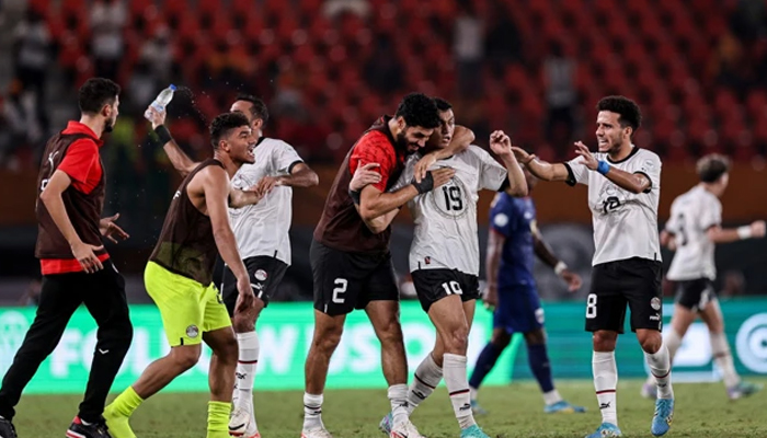 Egyptian footballer Mostafa Mohamed (2R) celebrates with teammates after scoring his teams second goal during the Africa Cup of Nations (CAN) 2024 group B football match between Cape Verde and Egypt at the Felix Houphouet-Boigny Stadium in Abidjan on 22 January 2024. — AFP