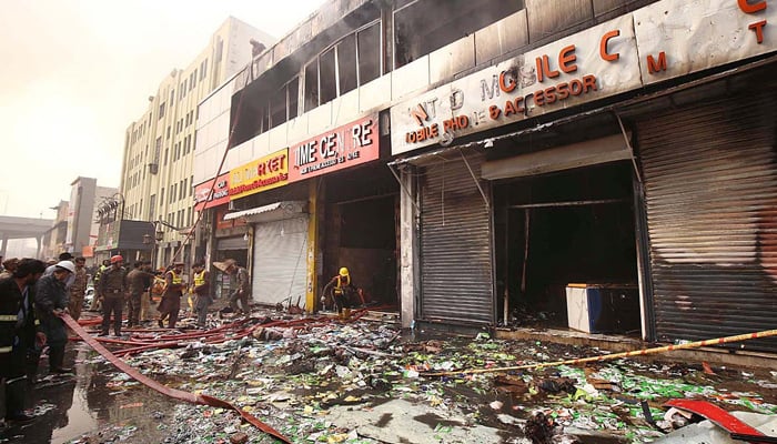 A view of damages caused by a fire in the Time Center mobile market at Saddar,  Peshawar on January 22, 2024. —  APP