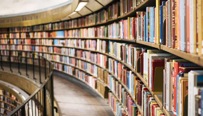 This representational image shows multiple books in the library. — Unsplash